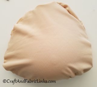 insert bra prosthesis into pouch